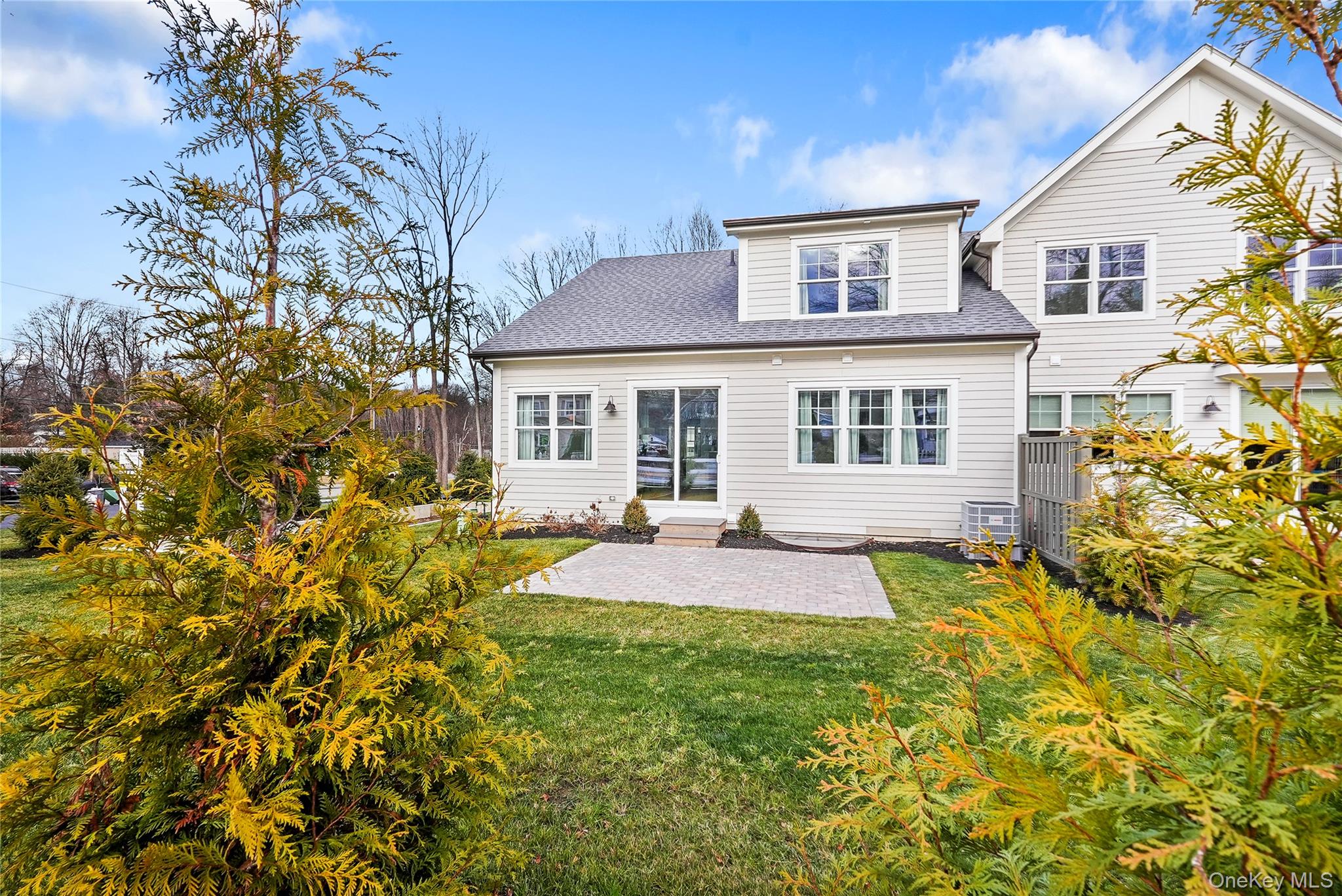 2040 Crompond Road, Unit 17 Yorktown Heights, NY 10598 - Photo 22 of 22 Back of house with a patio and a lawn