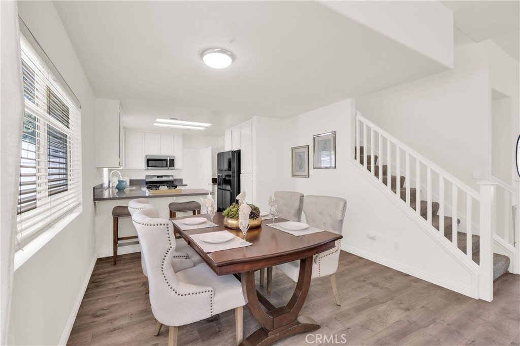 5895 Applecross Drive Riverside, CA 92507 - Photo 12 of 35 a view of a dining room with furniture window and wooden floor