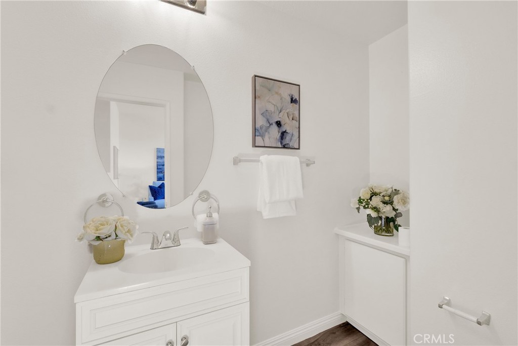 5895 Applecross Drive Riverside, CA 92507 - Photo 16 of 35 a bathroom with a sink and mirror