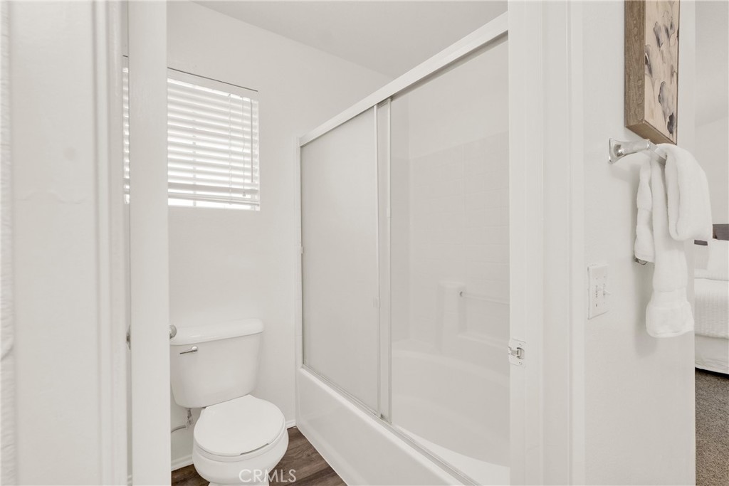 5895 Applecross Drive Riverside, CA 92507 - Photo 22 of 35 a white toilet sitting next to a bathroom sink