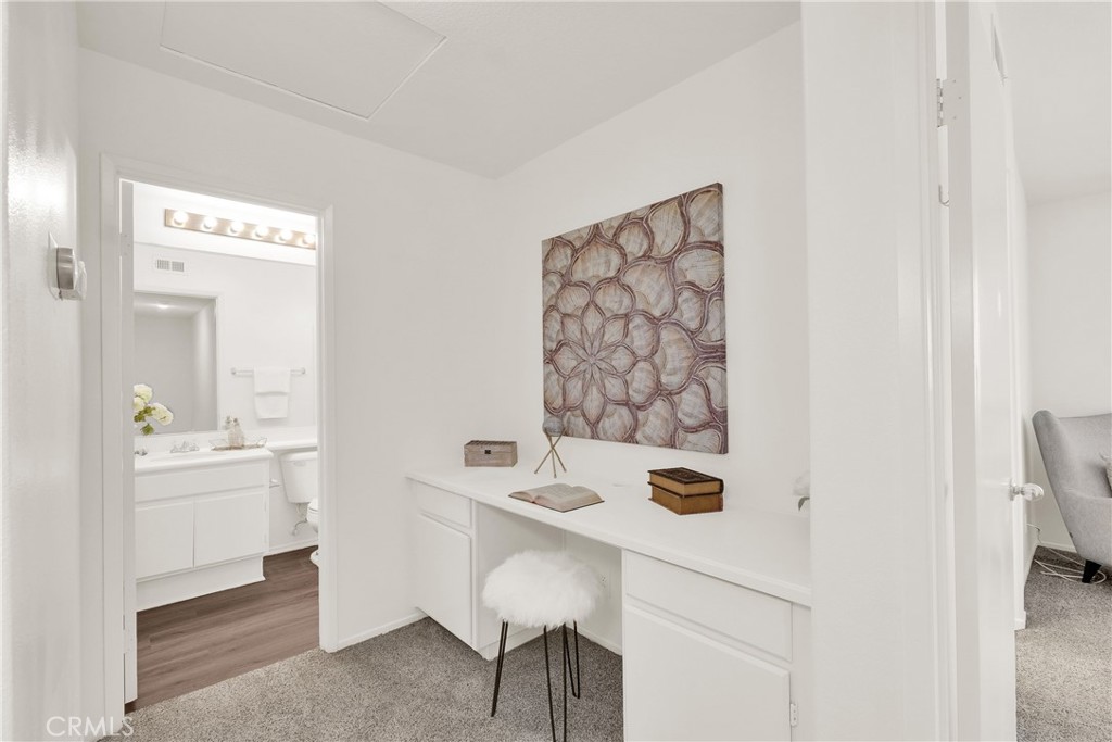 5895 Applecross Drive Riverside, CA 92507 - Photo 23 of 35 a bathroom with a sink a toilet and mirror