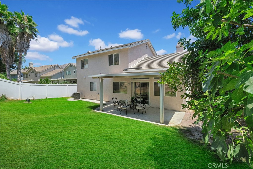 5895 Applecross Drive Riverside, CA 92507 - Photo 33 of 35 a view of a patio with table and chairs under an umbrella