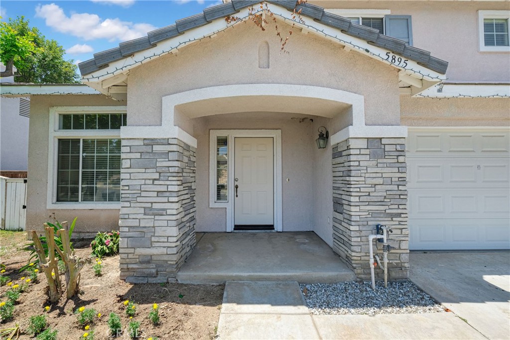 5895 Applecross Drive Riverside, CA 92507 - Photo 4 of 35 a front view of a house with a yard