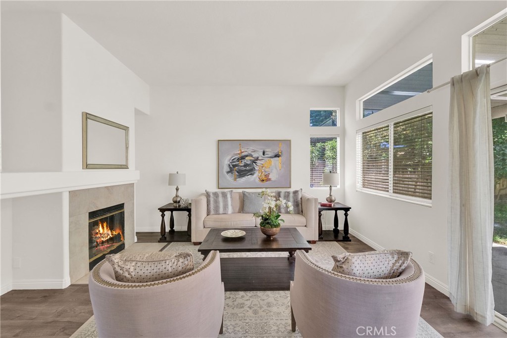 5895 Applecross Drive Riverside, CA 92507 - Photo 9 of 35 a living room with furniture a window and a fireplace