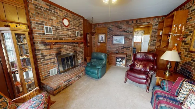 a bedroom with a bed and painting on the wall