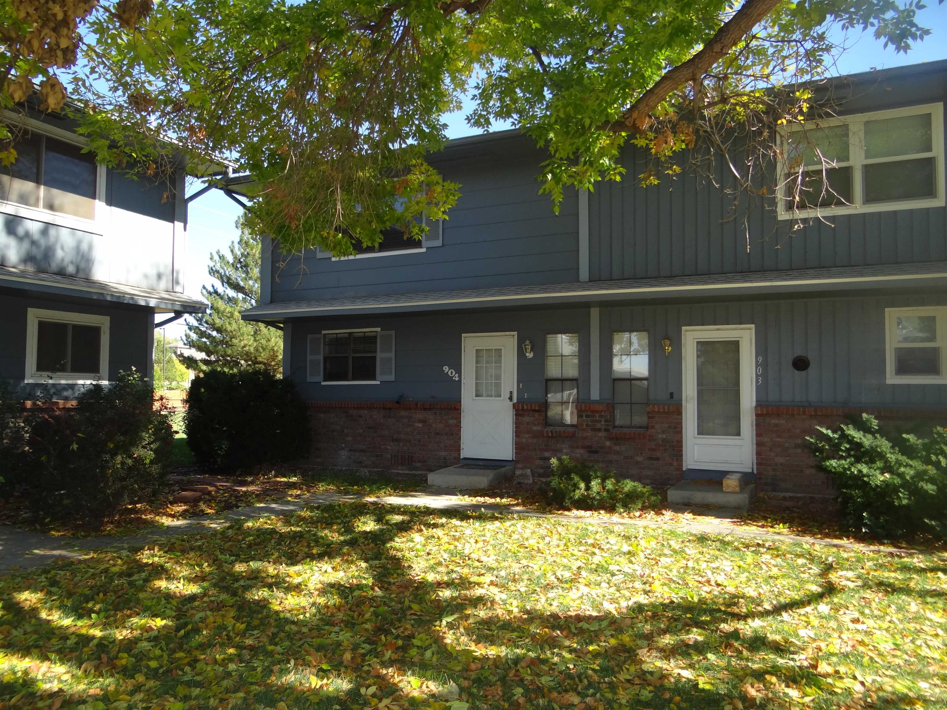 2721 Patterson Road, Unit 904 Grand Junction, CO 81506 - Photo 1 of 23 a front view of a house with a yard