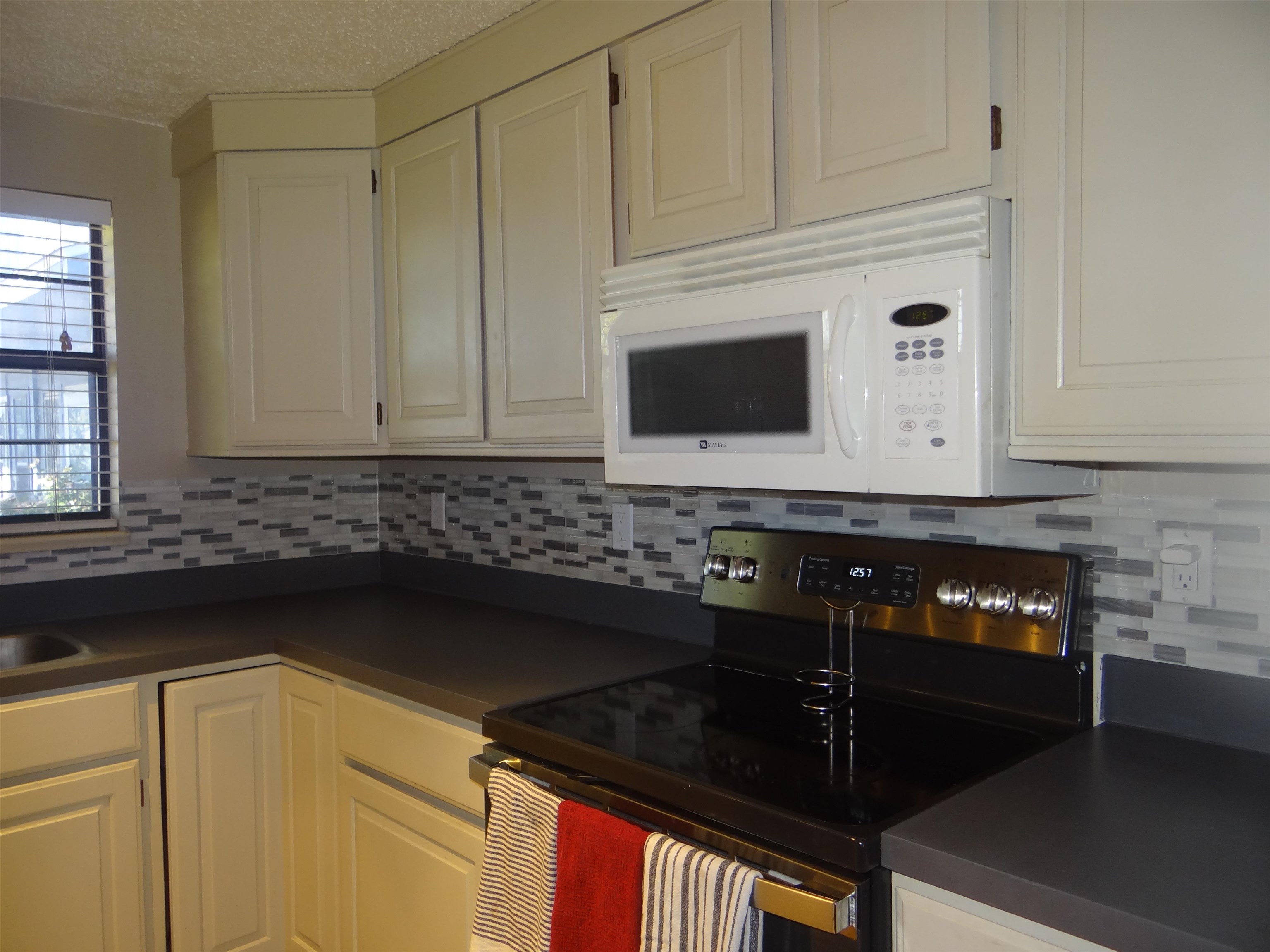 2721 Patterson Road, Unit 904 Grand Junction, CO 81506 - Photo 8 of 23 a kitchen with a sink and cabinets