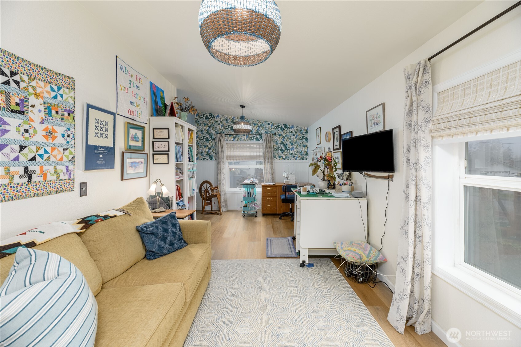 1238 West 11th Street Port Angeles, WA 98363 - Photo 19 of 26 a living room with furniture and a flat screen tv