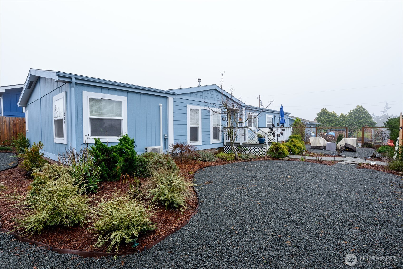 1238 West 11th Street Port Angeles, WA 98363 - Photo 2 of 26 a house view with a garden space