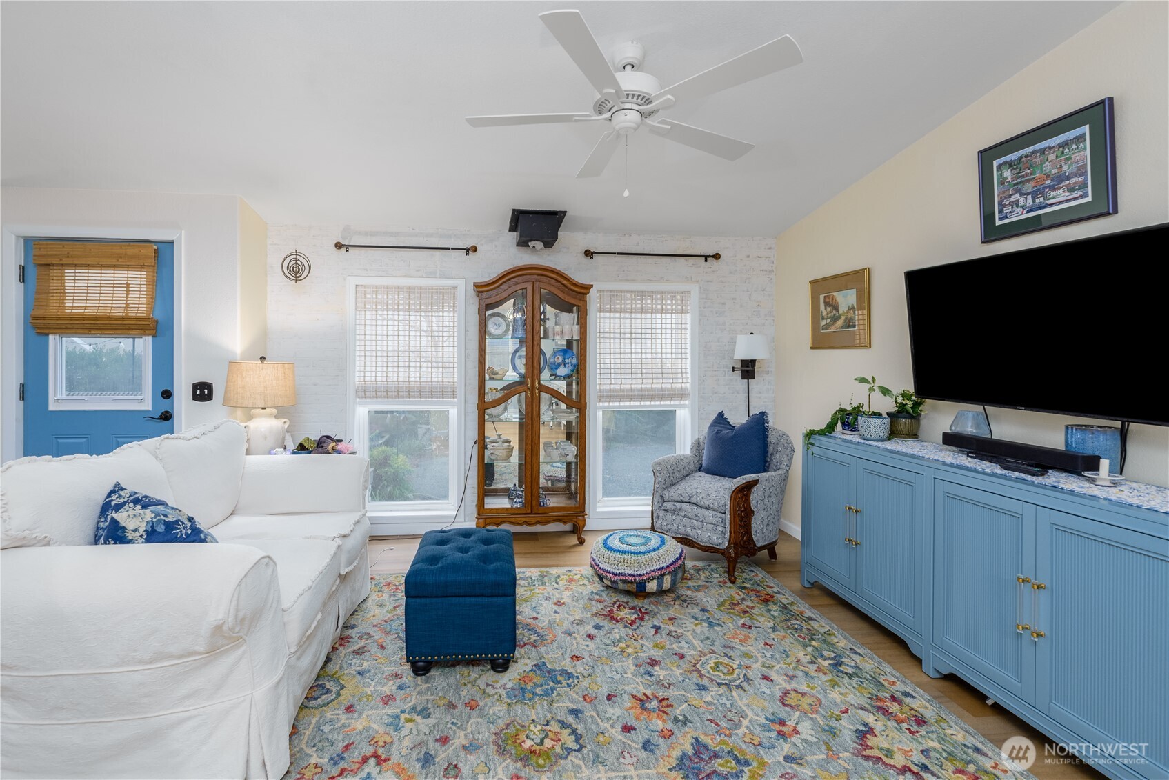 1238 West 11th Street Port Angeles, WA 98363 - Photo 6 of 26 a living room with furniture and a flat screen tv