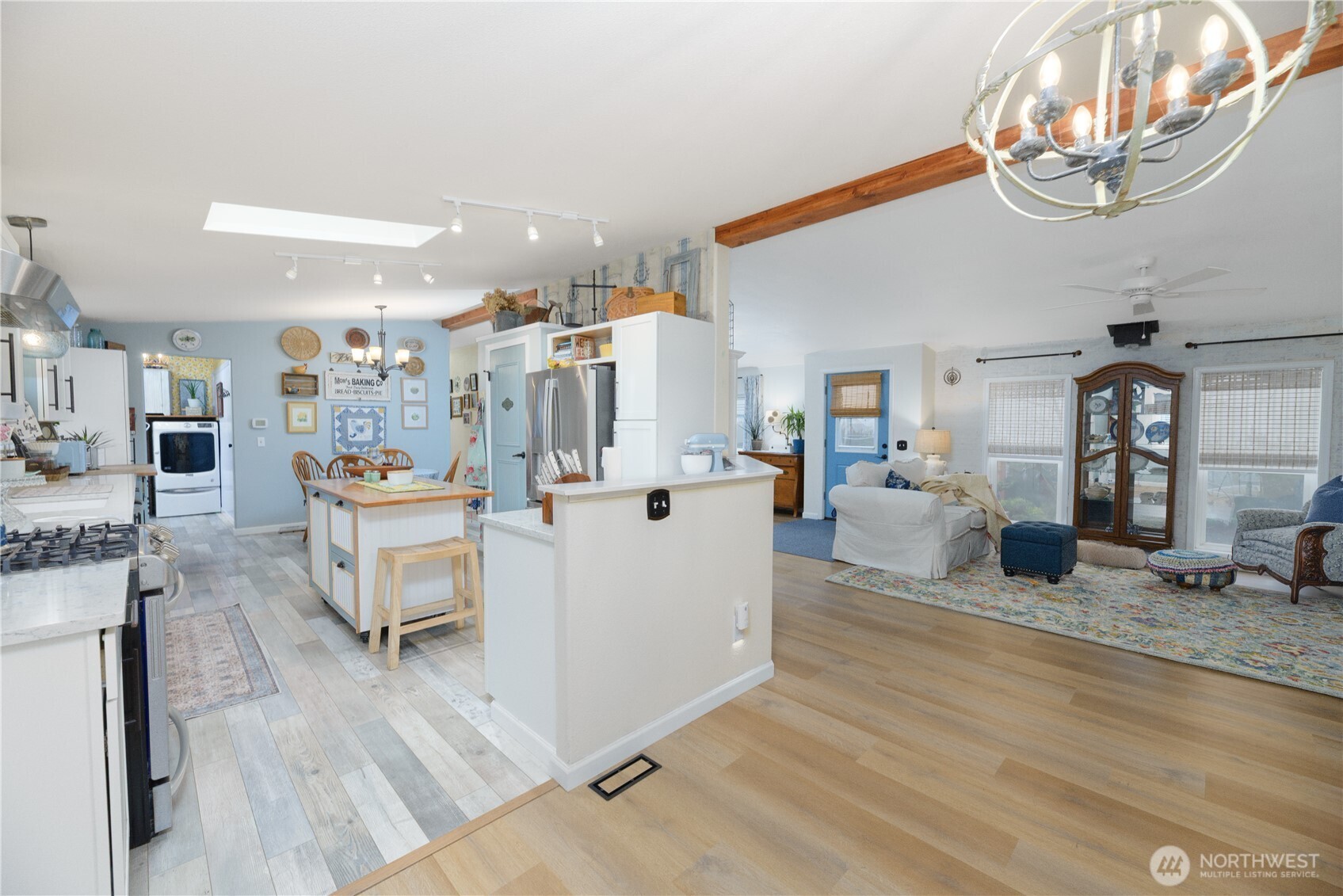 1238 West 11th Street Port Angeles, WA 98363 - Photo 10 of 26 a living room with furniture and a chandelier