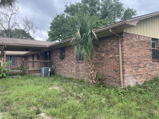 6047 Eden Square Crestview, FL 32539 - Photo 34 of 39 a backyard of a house with table and chairs