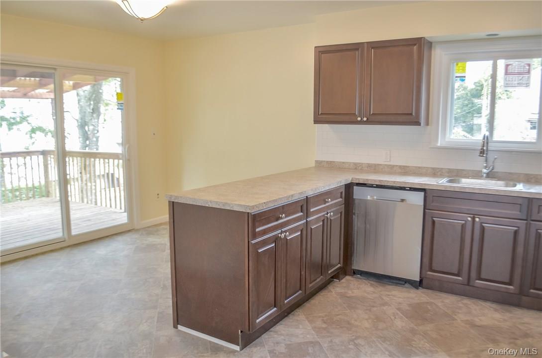 11 Elm Street, Unit 2 Sleepy Hollow, NY 10591 - Photo 2 of 33 a kitchen with stainless steel appliances granite countertop a sink and a stove