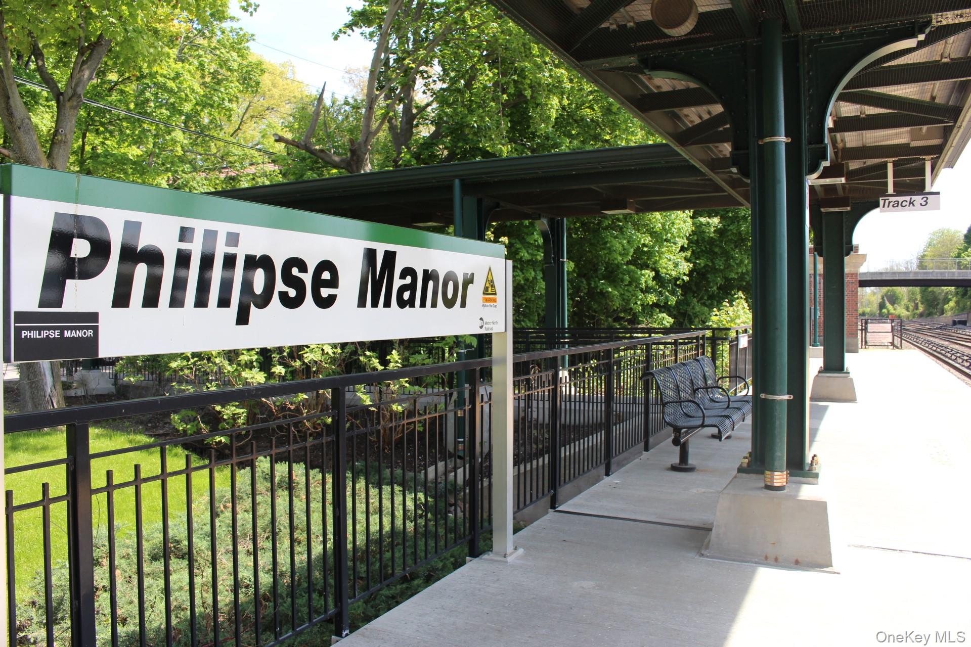 11 Elm Street, Unit 2 Sleepy Hollow, NY 10591 - Photo 30 of 33 a view of a street sign under a large tree