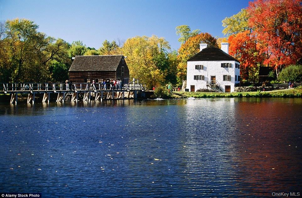 11 Elm Street, Unit 2 Sleepy Hollow, NY 10591 - Photo 32 of 33 a front view of a house with lake view and a car parked