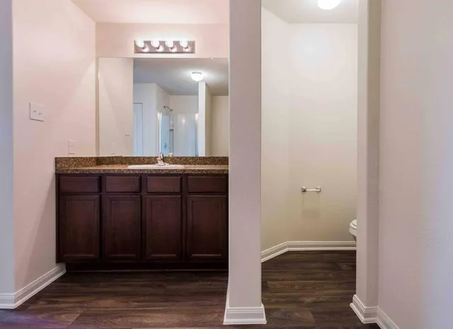 a white bath tub sitting next to a white wall