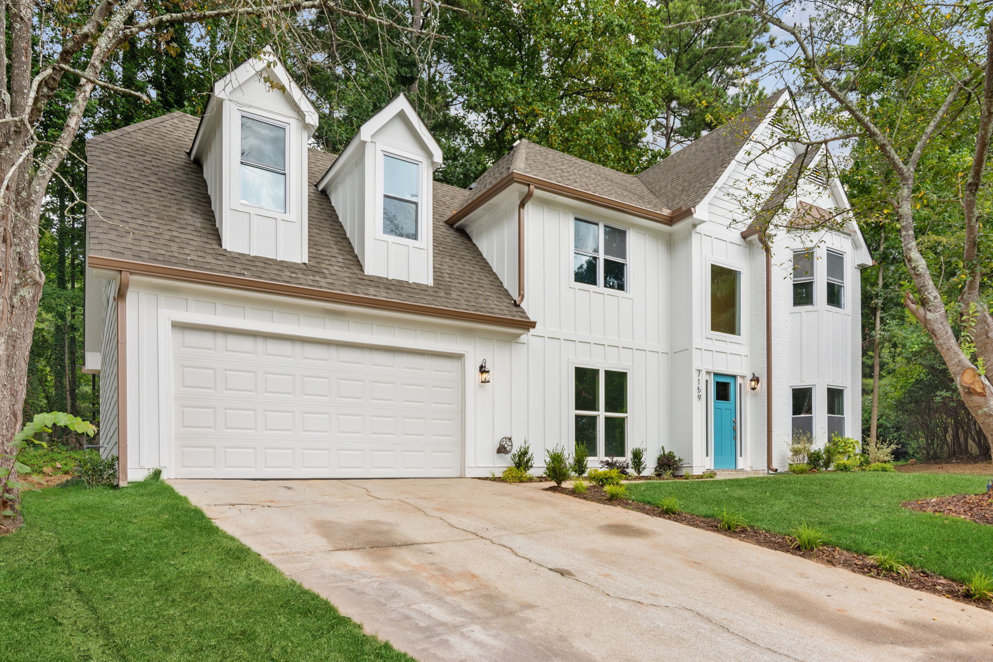 front view of a house with a yard