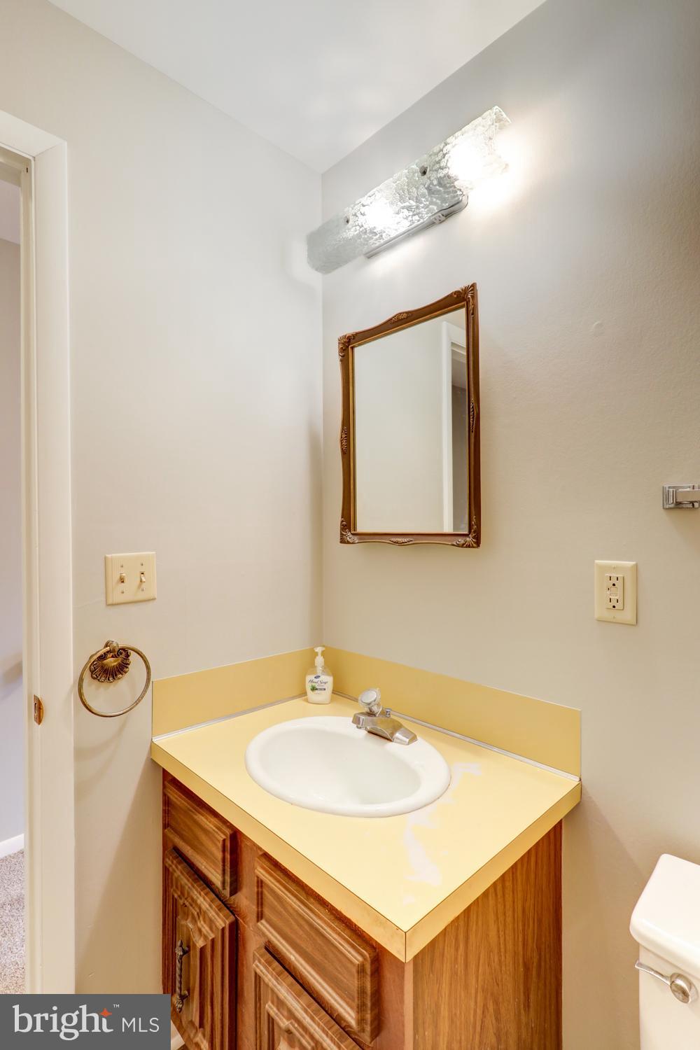 813 Fremont Street Lancaster, PA 17603 - Photo 13 of 33 a bathroom with a sink vanity and a mirror