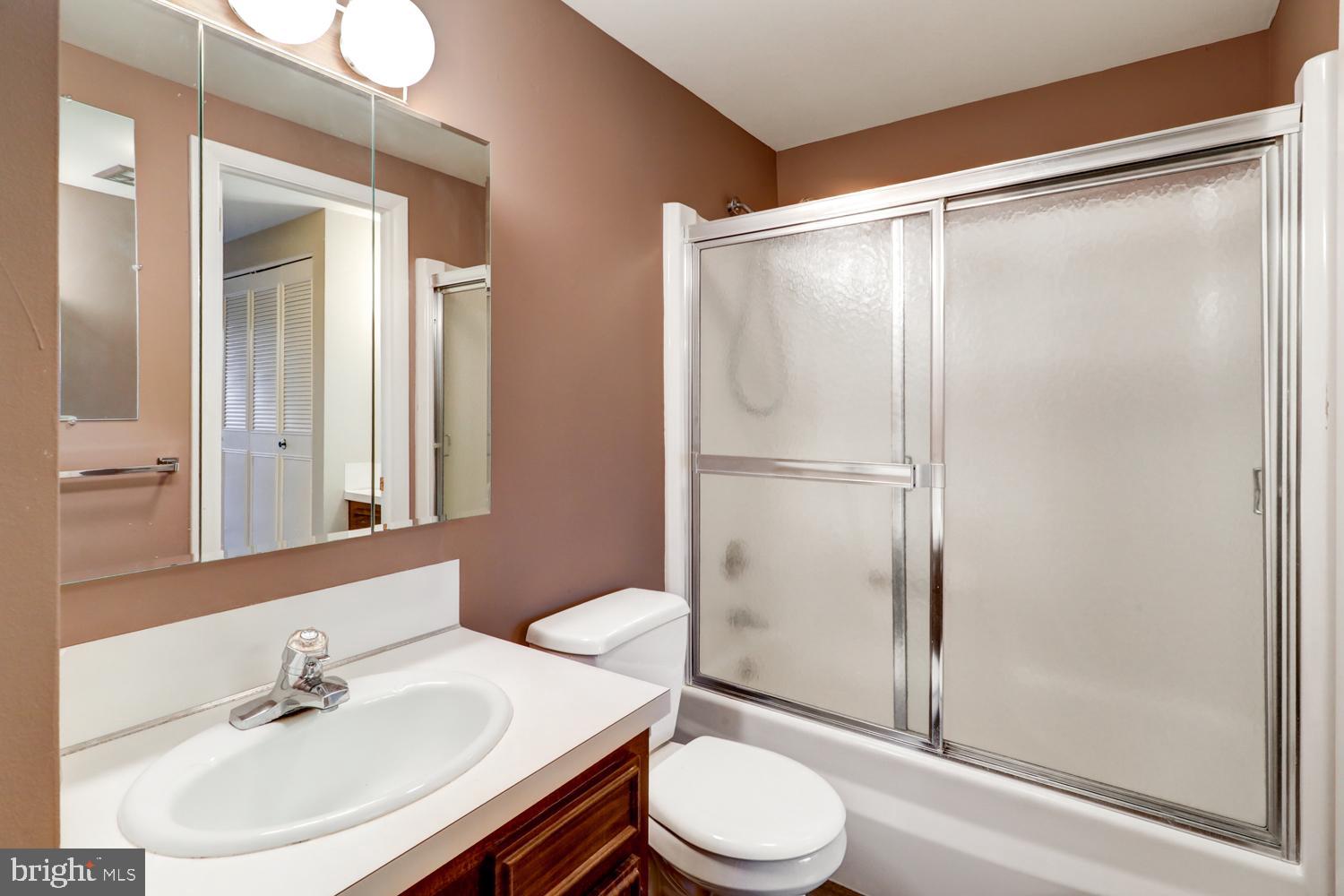 813 Fremont Street Lancaster, PA 17603 - Photo 25 of 33 a bathroom with a sink mirror vanity and toilet