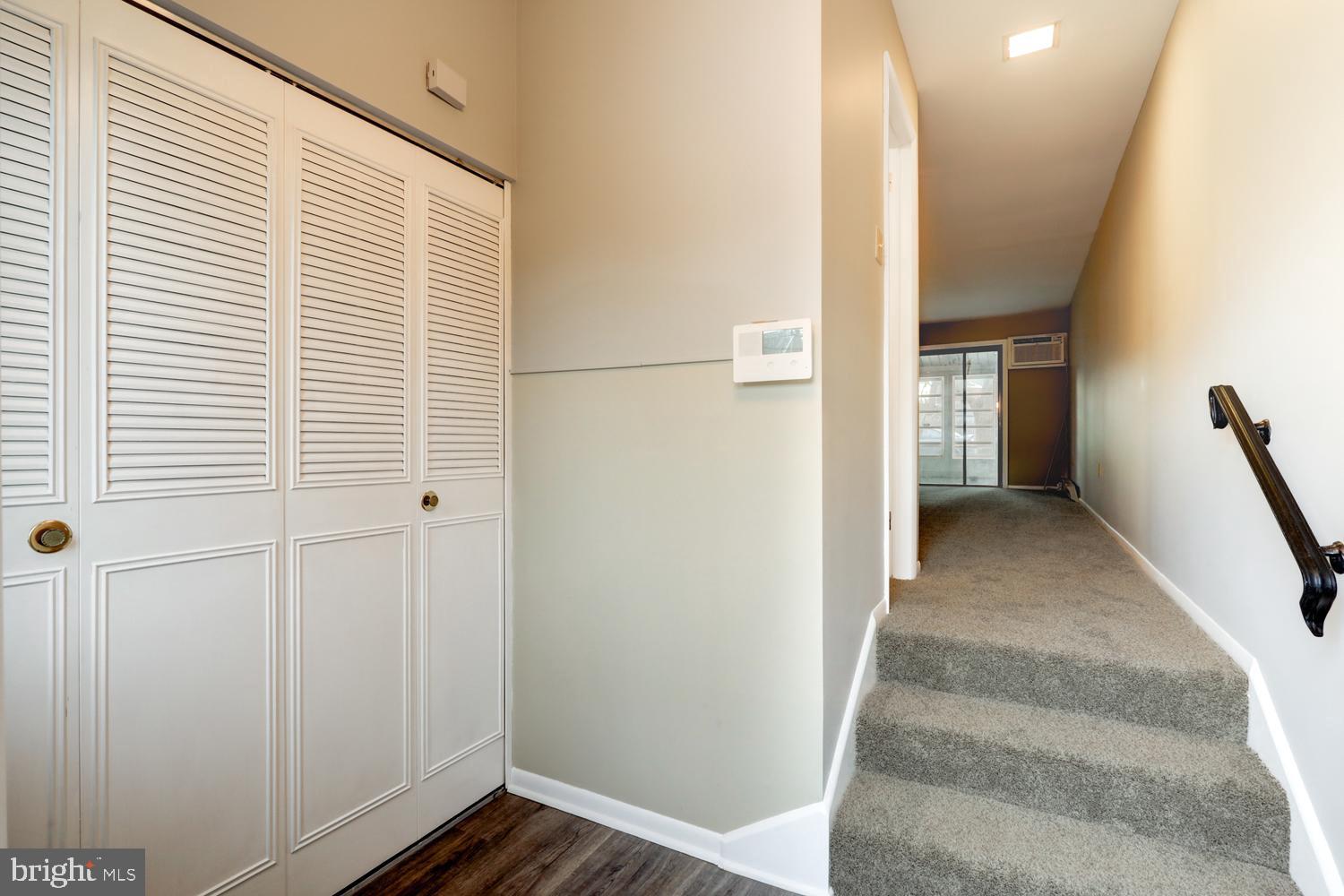 813 Fremont Street Lancaster, PA 17603 - Photo 3 of 33 a view of a hallway with wooden floor and staircase