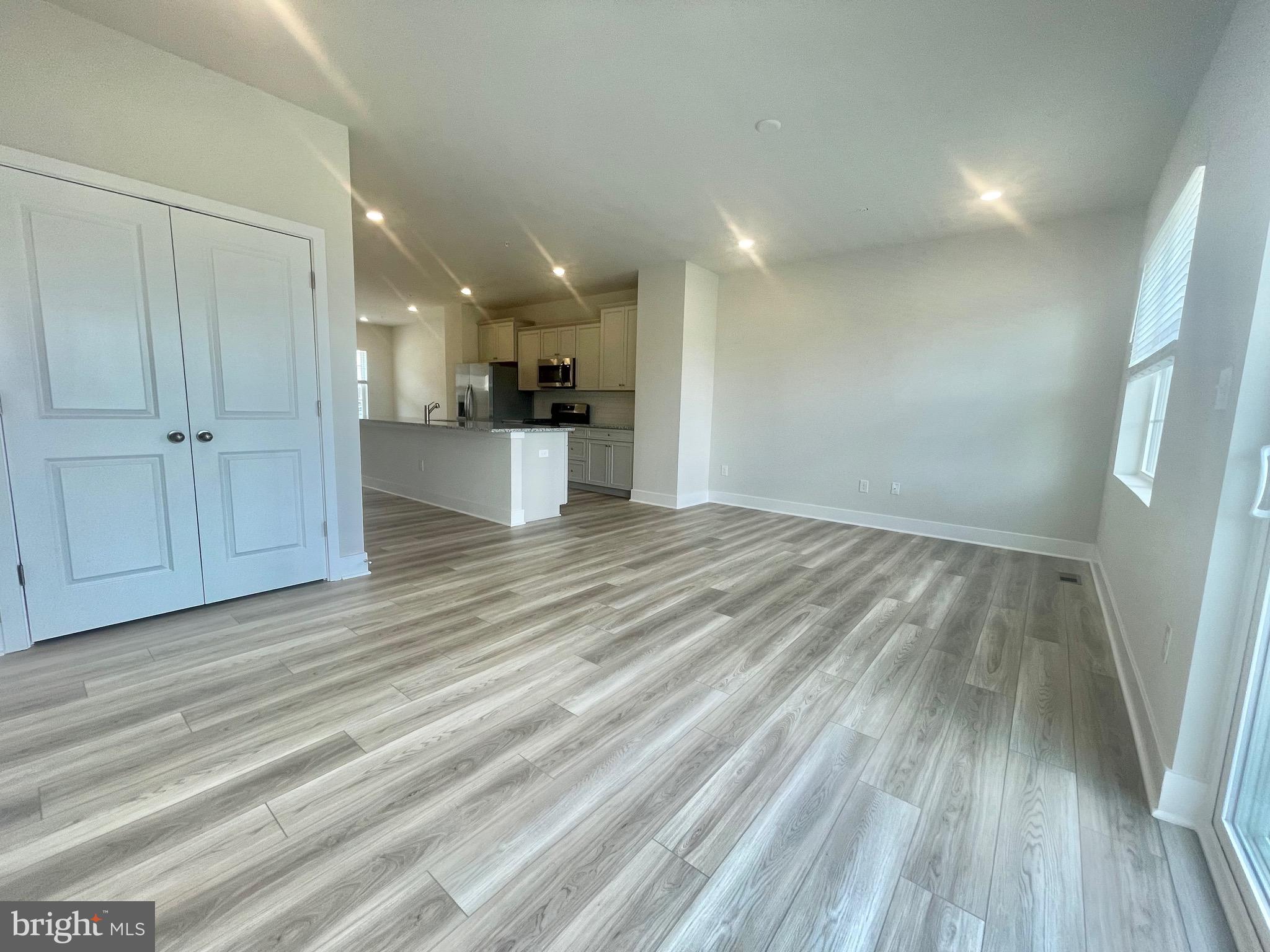 2264 Marcy Drive Frederick, MD 21702 - Photo 11 of 39 a view of empty room with wooden floor