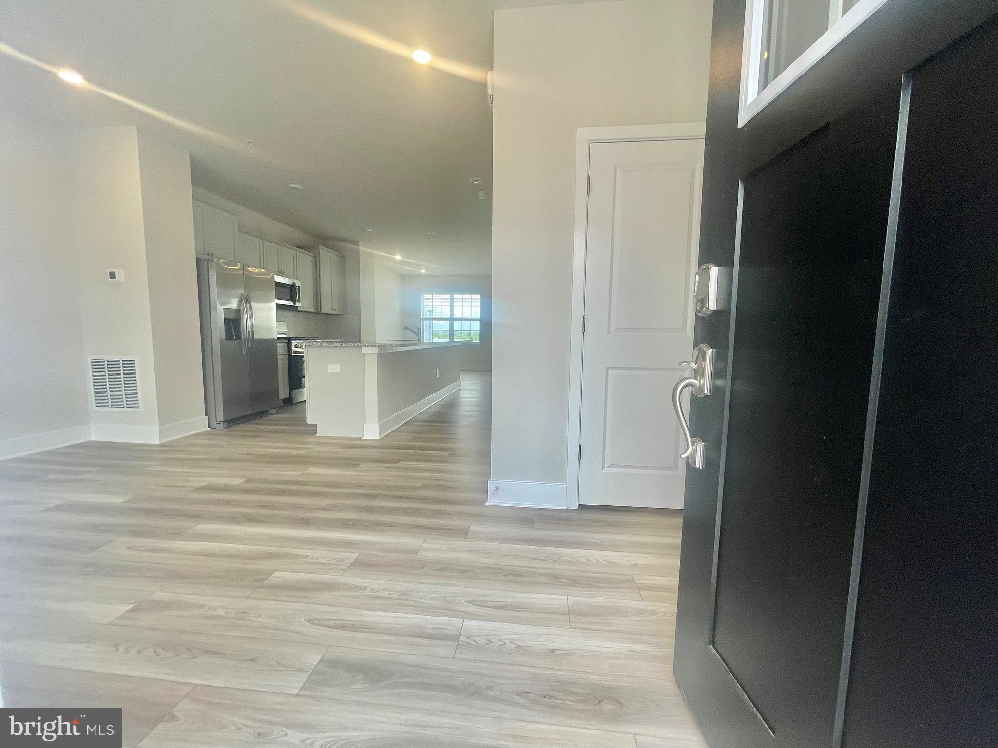 2264 Marcy Drive Frederick, MD 21702 - Photo 2 of 39 a view of a kitchen from the hallway