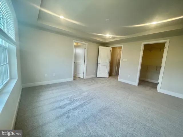 a view of an empty room with a fireplace