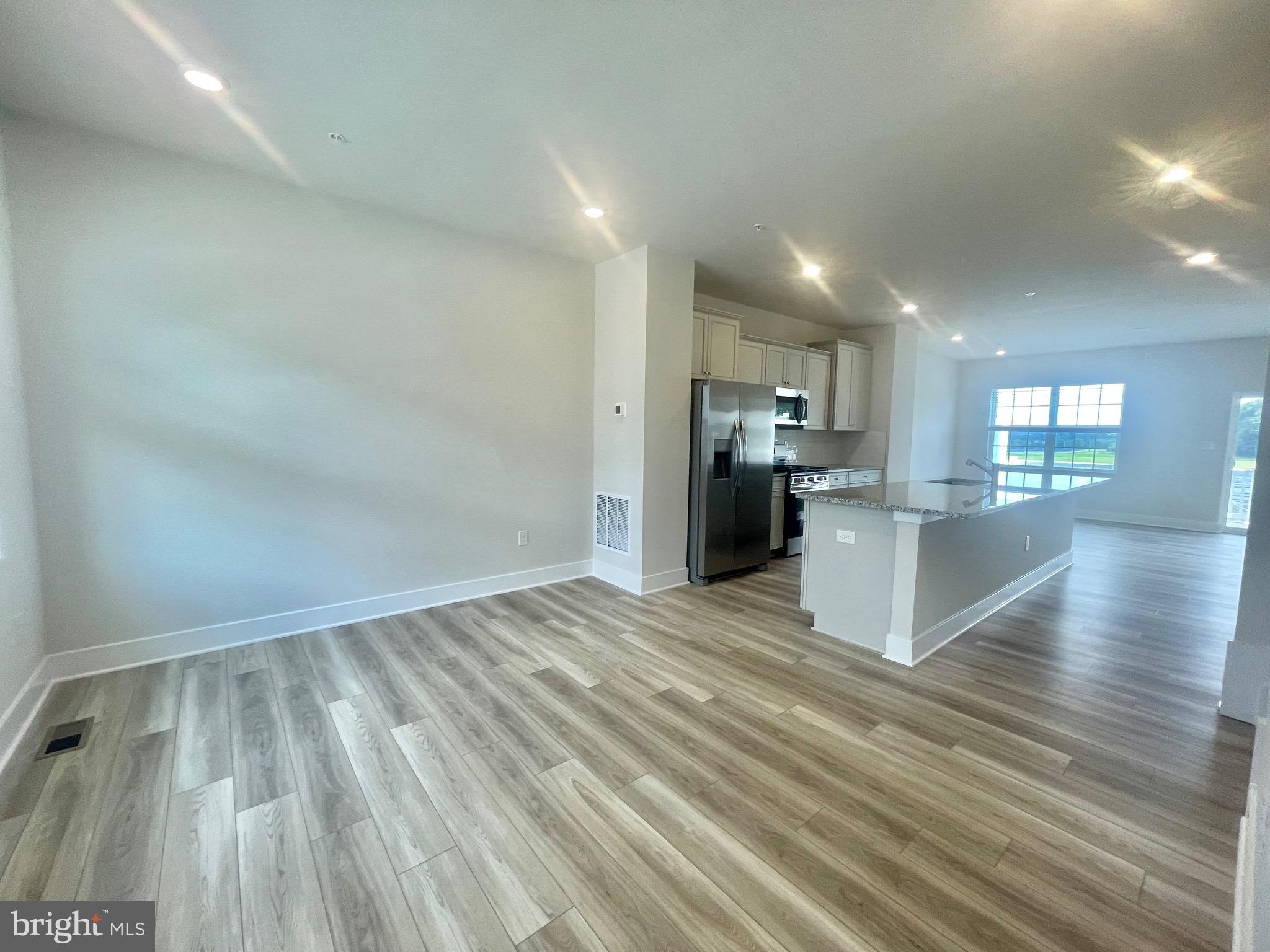 2264 Marcy Drive Frederick, MD 21702 - Photo 5 of 39 a view of a kitchen with wooden floor and a kitchen