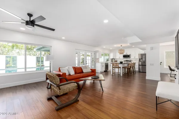 a living room with furniture a potted plant and a fireplace