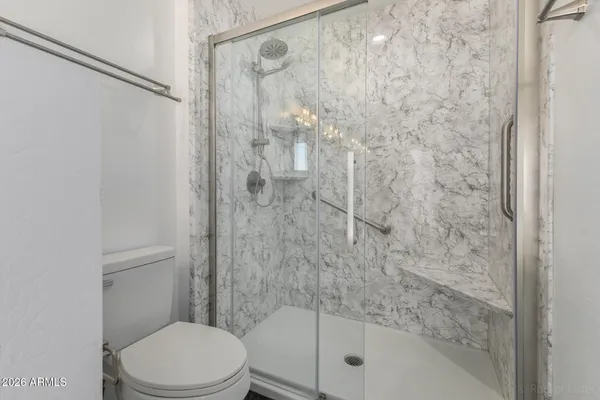 a view of empty room with a ceiling fan