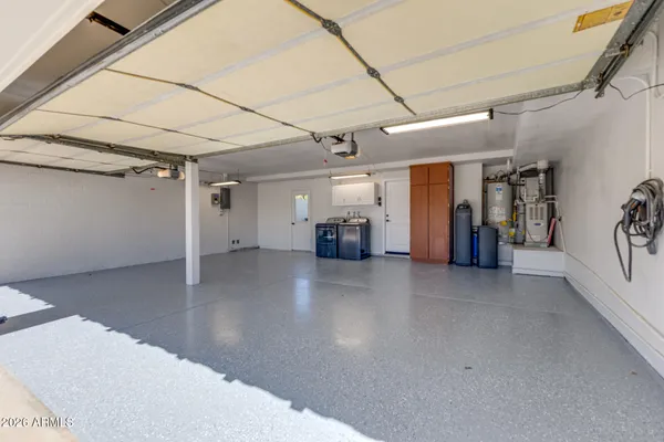 a view of a house with roof deck and sitting area