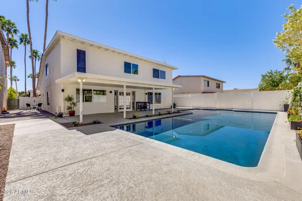 a view of a swimming pool with a patio