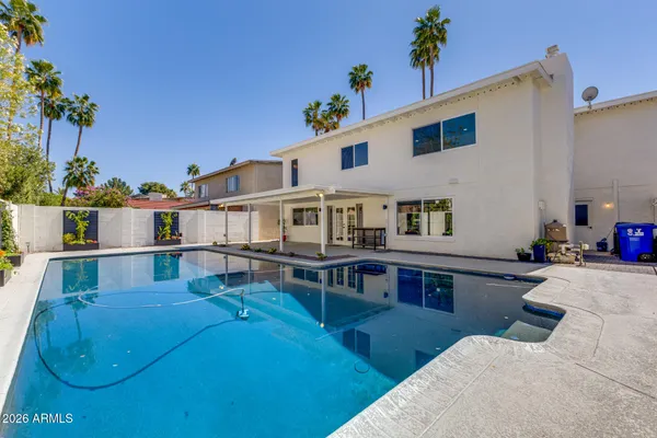 a spacious bathroom with a sink and a mirror