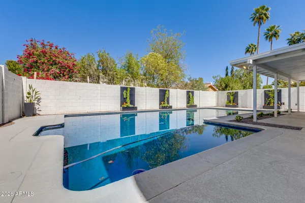 an aerial view of a house with outdoor space