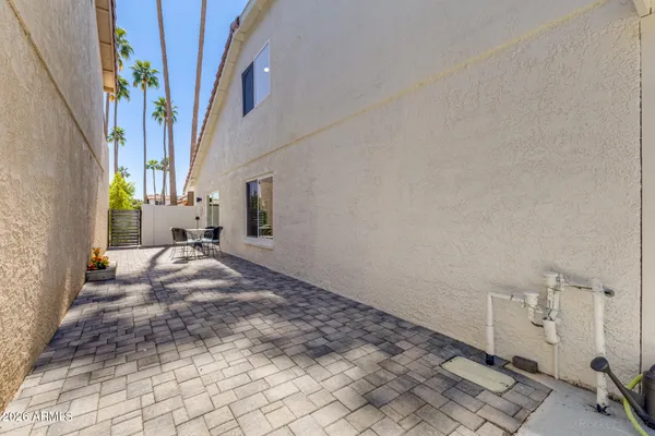 an aerial view of a house with pool patio and outdoor seating