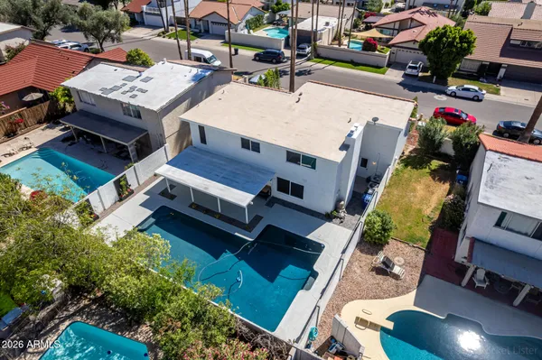 a front view of a house with a yard and a garage