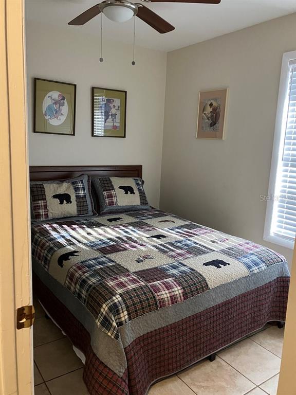 25079 Northeast 140th Loop Salt Springs, FL 32134 - Photo 13 of 23 a bedroom with a bed and the window