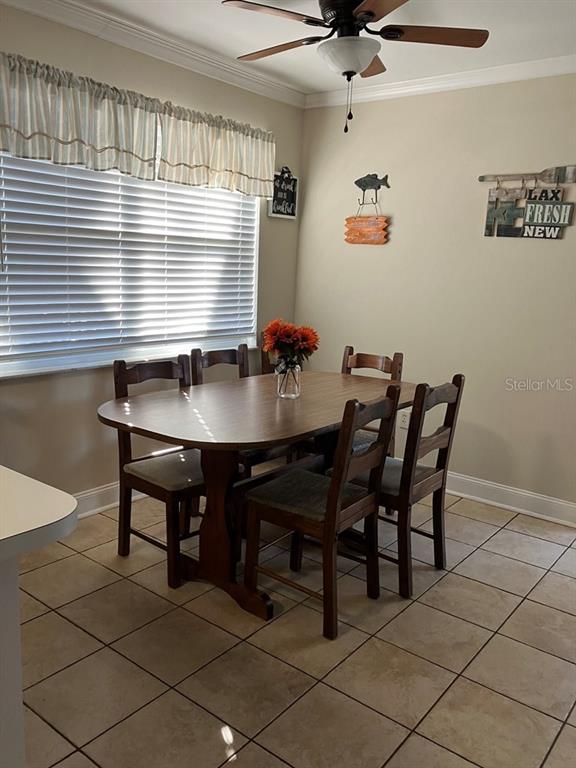25079 Northeast 140th Loop Salt Springs, FL 32134 - Photo 16 of 23 a view of a dining room with furniture