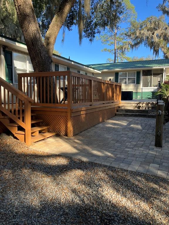 25079 Northeast 140th Loop Salt Springs, FL 32134 - Photo 5 of 23 a view of a house with a yard and sitting area