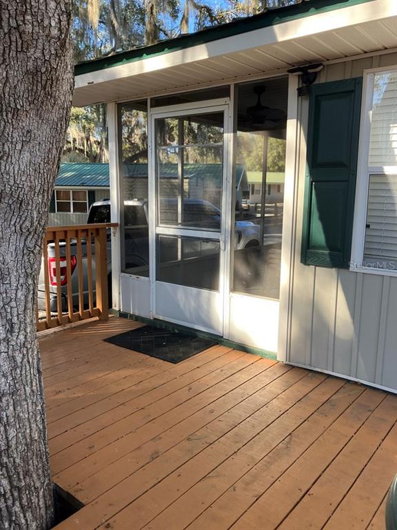 25079 Northeast 140th Loop Salt Springs, FL 32134 - Photo 7 of 23 a front view of a house with a porch