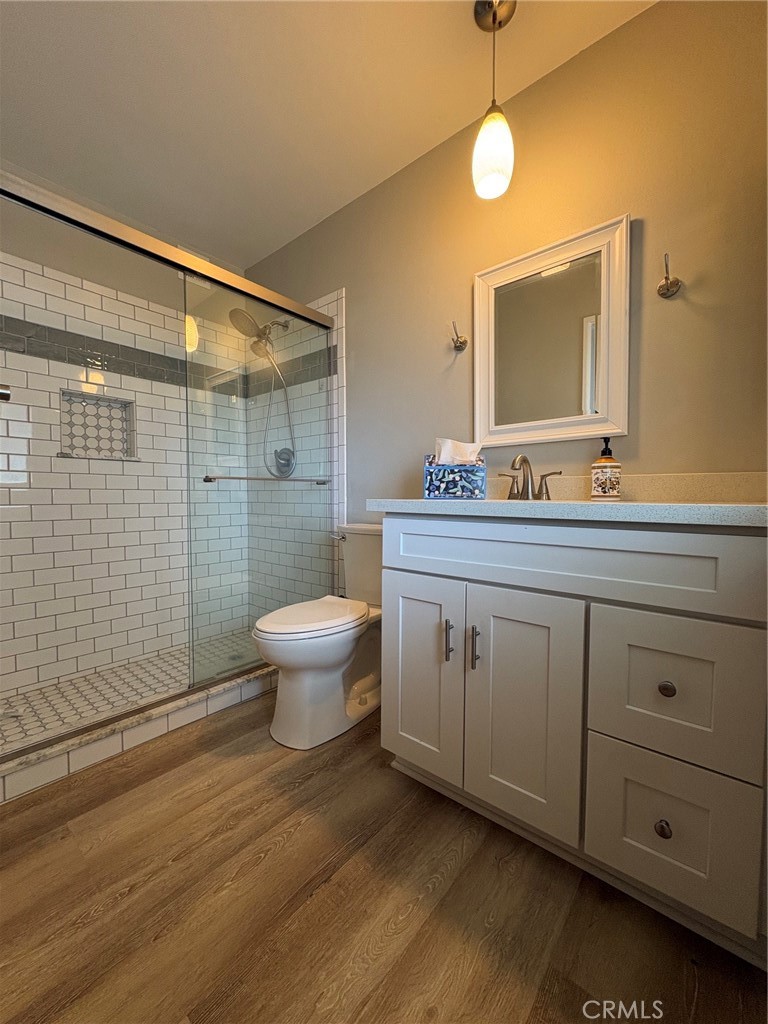 26378 Ridgemoor Road Menifee, CA 92586 - Photo 8 of 20 a bathroom with a double vanity sink toilet and shower