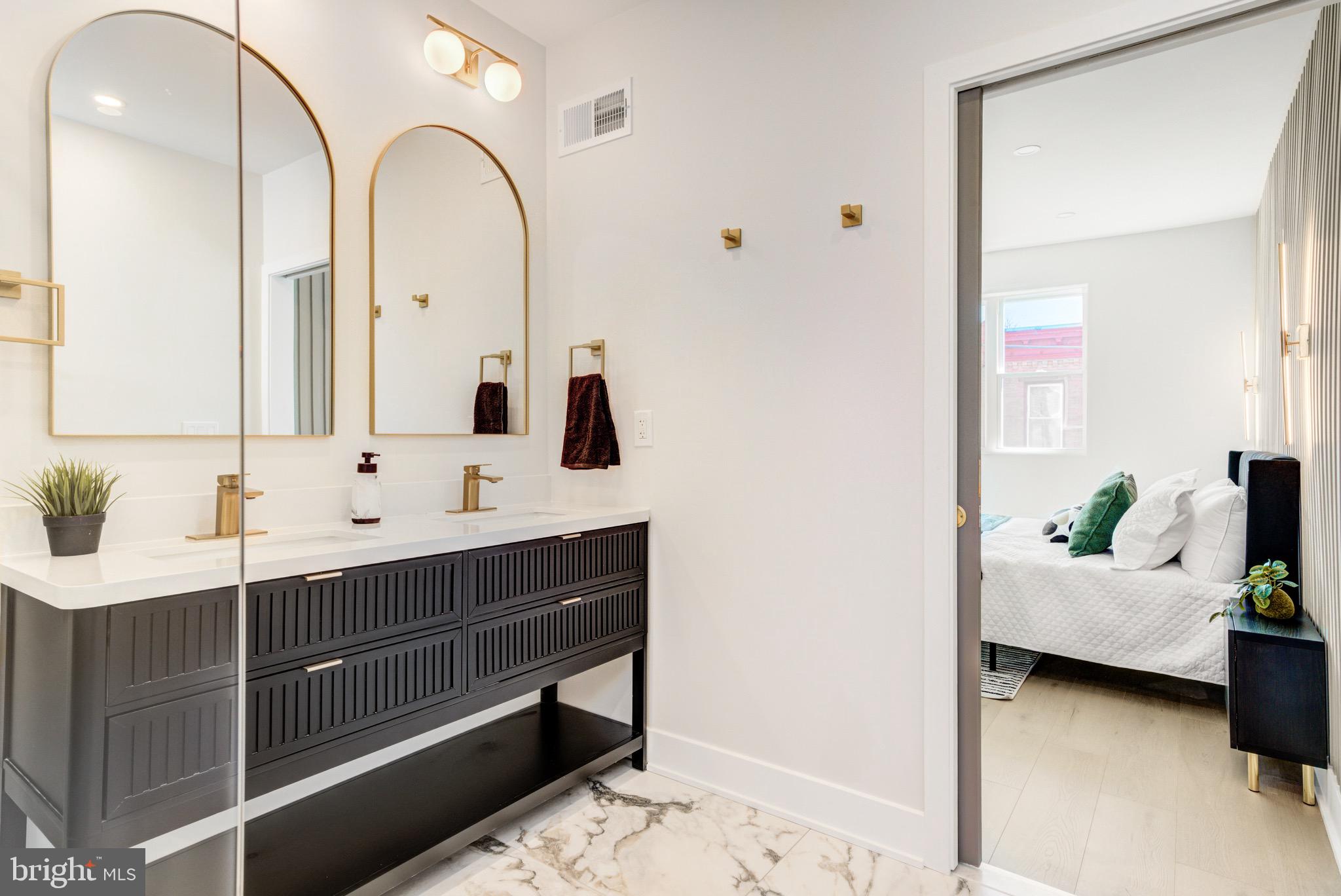 1924 South Lambert Street Philadelphia, PA 19145 - Photo 26 of 35 a en suite spacious bathroom with a double vanity sink and a mirror