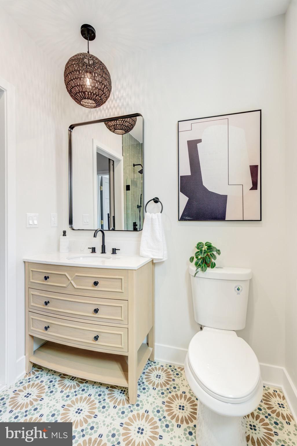 1924 South Lambert Street Philadelphia, PA 19145 - Photo 29 of 35 a bathroom with a toilet a sink and mirror