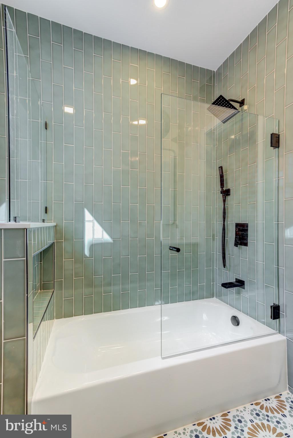 1924 South Lambert Street Philadelphia, PA 19145 - Photo 30 of 35 a bathroom with a bathtub and a shower