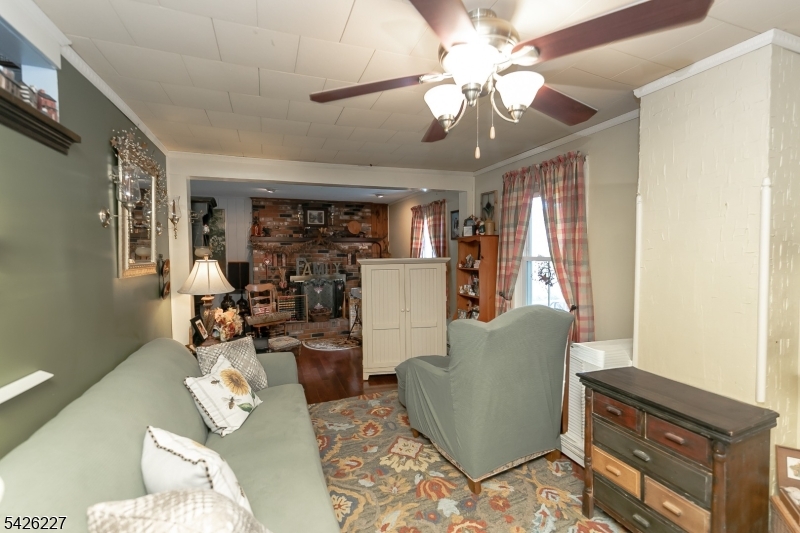36 Main Street Flanders, NJ 07836 - Photo 17 of 49 a living room with furniture and a chandelier