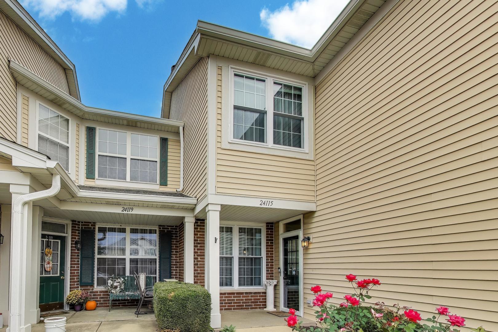 24115 Pear Tree Circle Plainfield, IL 60585 - Photo 2 of 15 a view of building with a window and potted plants
