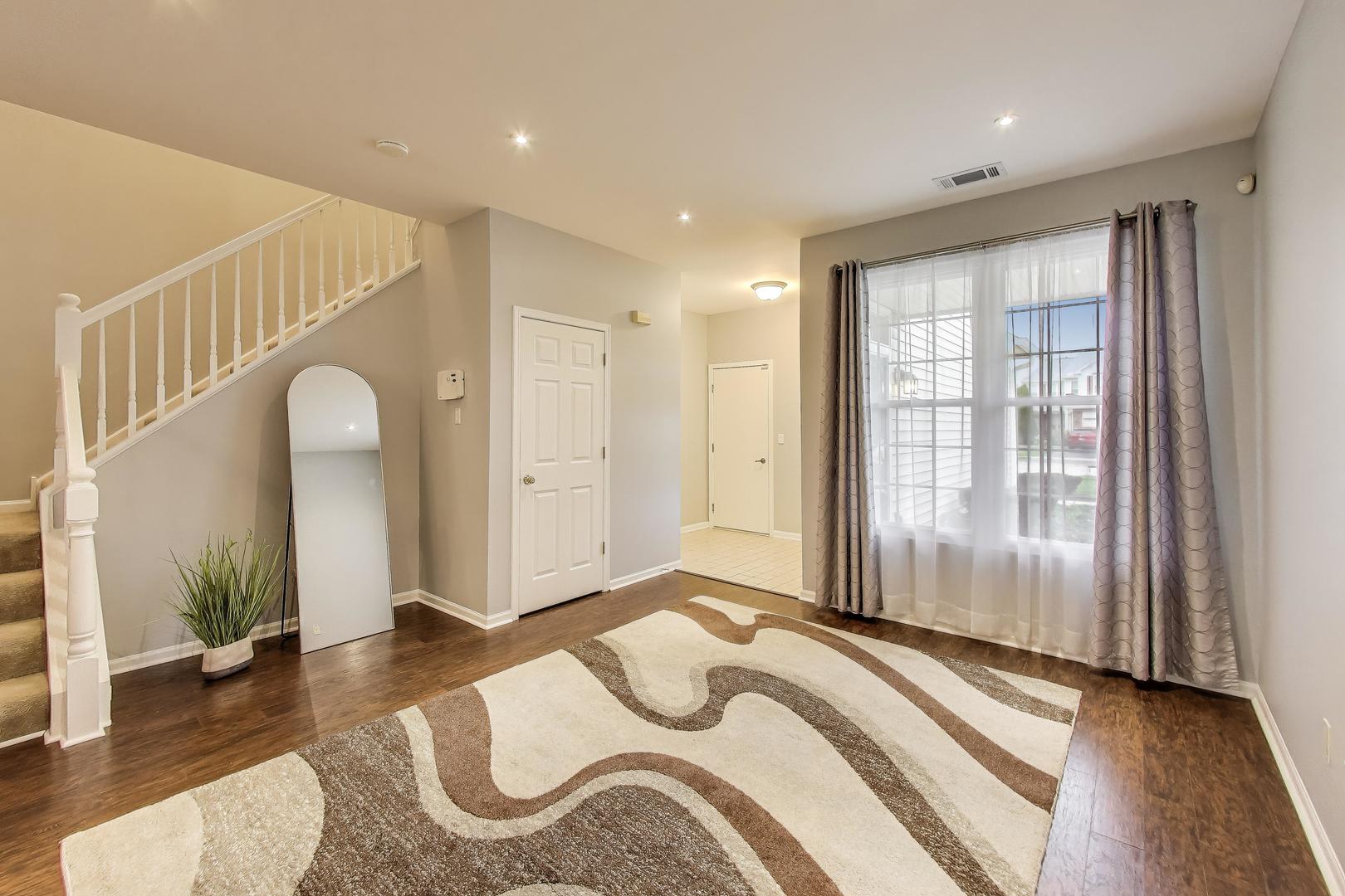 24115 Pear Tree Circle Plainfield, IL 60585 - Photo 3 of 15 a bedroom with bed and a large window