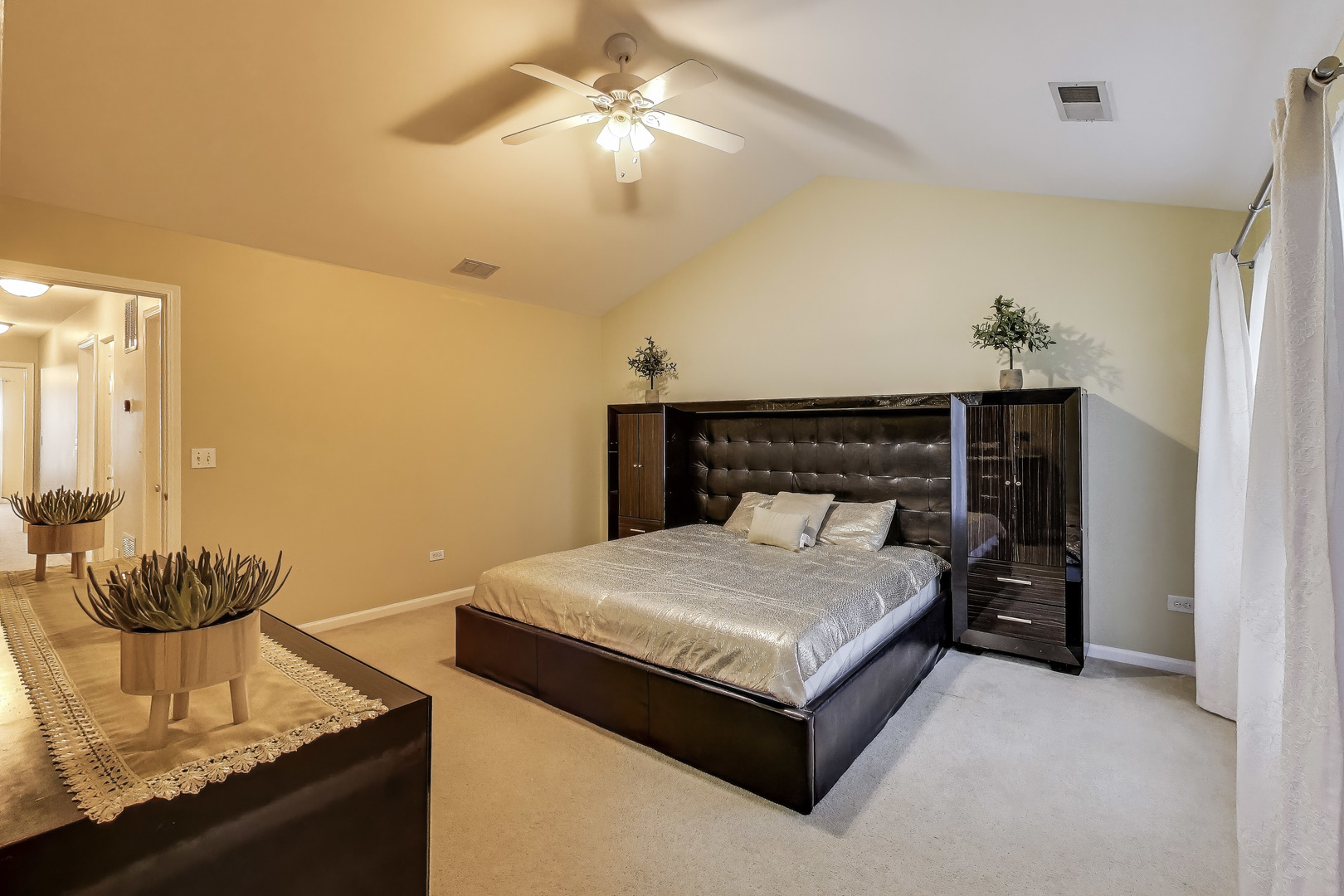 24115 Pear Tree Circle Plainfield, IL 60585 - Photo 9 of 15 a spacious bedroom with a bed and a chandelier