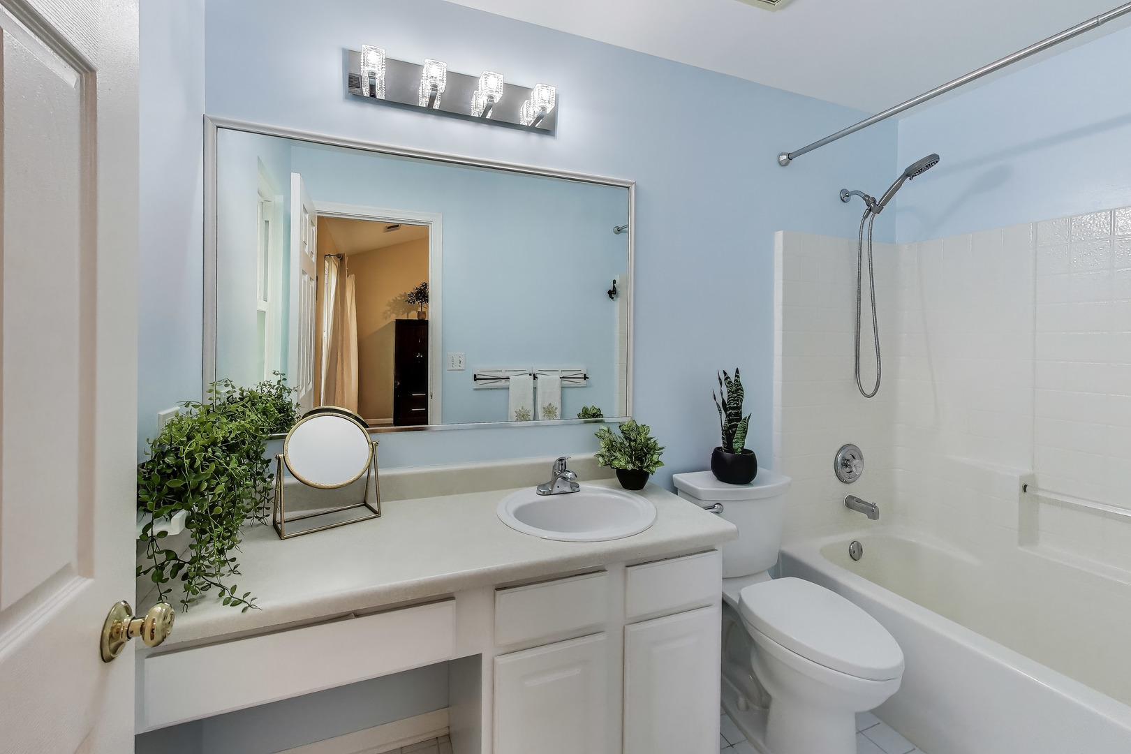 24115 Pear Tree Circle Plainfield, IL 60585 - Photo 10 of 15 a bathroom with a sink a toilet a mirror a vanity and shower