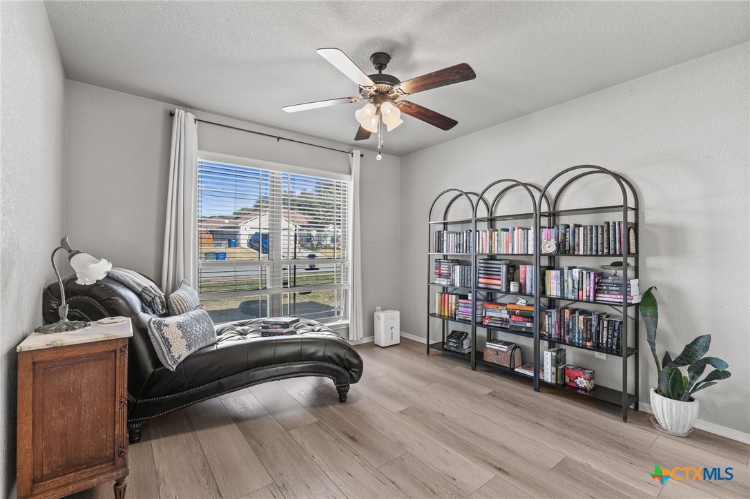 3437 Samuel Street Copperas Cove, TX 76522 - Photo 17 of 31 a bedroom with furniture and a book shelf